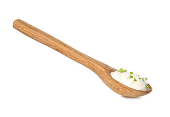 Spoon with tasty sour cream on white background