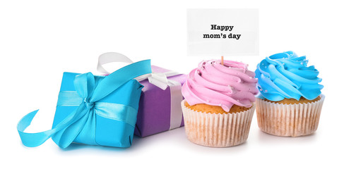Tasty cupcake and gifts for Mother's Day on white background