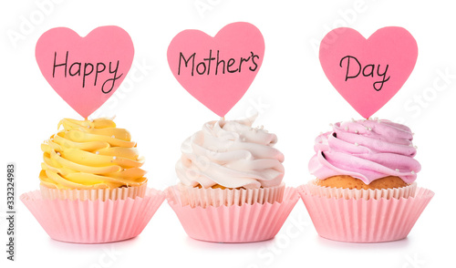 Tasty cupcakes for Mother's Day on white background