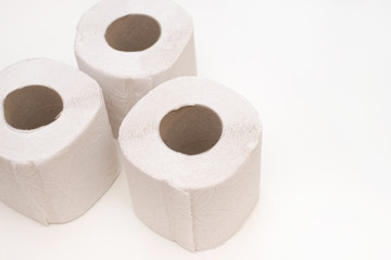 Rolls of toilet paper arranged on white background