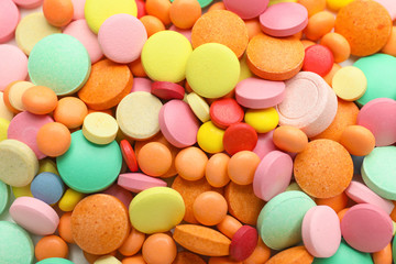 Fototapeta na wymiar Heap of different pills as background