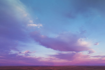 Naklejka na ściany i meble Colorful cloudy sky at sunset. Gradient color. Sky texture. Abstract natural background