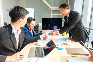 Business meeting, Young coworker team making great business discussion with computer in co-working office. Teamwork people concept.