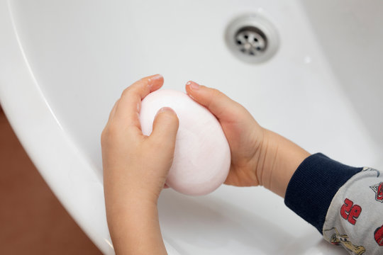 Boy Washes Hands With Soap In Bathroom. Personal Hygiene Practices