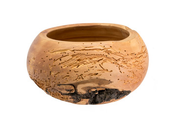 Hand-turned wooden bowl made of light worm-eaten wood