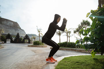 attractive sport muslim woman with hijab exercise outdoor