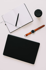 Business workspace background with laptop, coffee, pen, wrist watch and notebook.  Working, business, freelance concept. top view