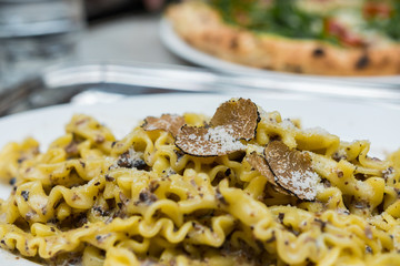 Truffle pasta. Delicious Italian fresh pasta with truffle pieces on the top, mascarpone and olive oil. Meal from the Felicita (Big Mamma) restaurant in Paris, France. Yummy! 