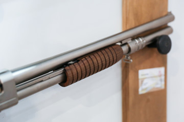 pump action shotgun close up in the shop 