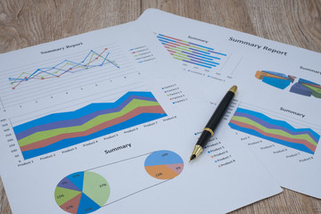 Pen graphs and calculators placed on the table. Concepts Data documents Graphs Graphs Marketing reports Research Development Planning Management Analysis Financial Accounting Strategy.