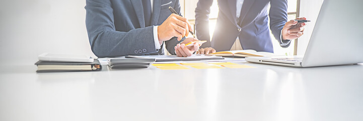 Business adviser analyzing financial figures denoting the progress Internal Revenue Service checking document. Audit concept