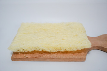 one box of dried vermicelli on a wooden tray