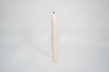 white candle on a white background
