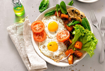 Breakfast table Breakfast plate fried eggs vegetables mushrooms toast top view healthy table