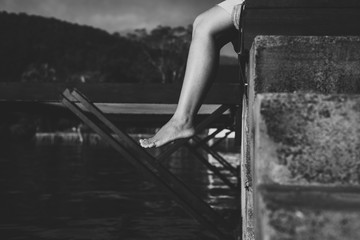 Close up legs woman sitting and feeling depression near river,Mental disorder health care,World...
