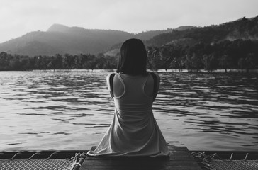 Woman sitting and feeling depression at sea,Mental disorder health care,World suicide prevention...