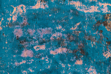 shabby stucco with cracks and flakes of paint flakes