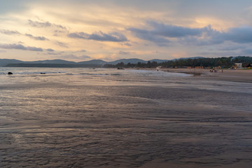 beautiful reflexions in the water at the beach in goa, india
