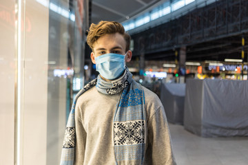 Young man wearing face mask, going for shopping at epidemic coronavirus time.