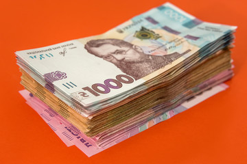 new 1000 banknote of 2020 year, ukraine money uah isolated on orange.
