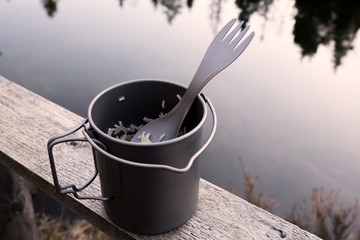 Rice in a titanium pot on the nature.