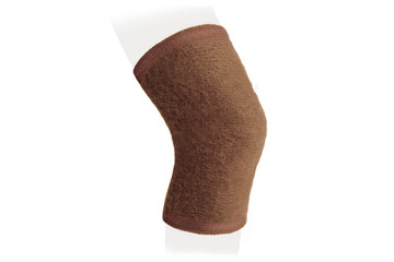 Knee Support Brace on leg isolated on white background. Orthopedic Anatomic Orthosis. Braces for knee fixation, injuries and pain. Orthotics. Foot orthosis. Knee Joint Bandage Sleeve. Elastic Sports 