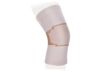 Knee Support Brace on leg isolated on white background. Orthopedic Anatomic Orthosis. Braces for knee fixation, injuries and pain. Orthotics. Foot orthosis. Knee Joint Bandage Sleeve. Elastic Sports 