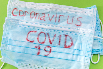 Obraz premium covid-19 epidemic virus concept, coronavirus 2019-ncov write on mask. medical protection respiratory for health disease