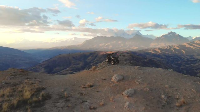 cuadracicle alone in front of the peruvian andes, view point.