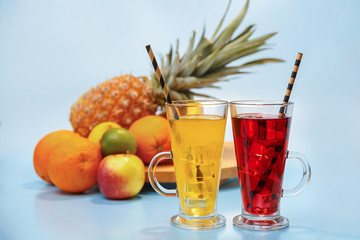 Fresh multifruit juice with ice in a glass.