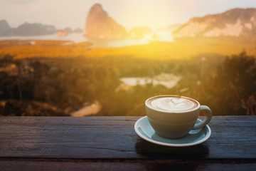 Coffee cup on wooden table in the morning, Coffee in the nature view.