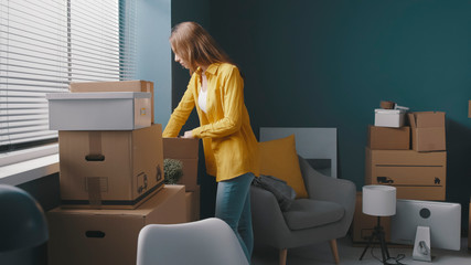 Woman moving in a new house