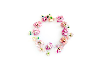 round frame with pink flowers and buds isolated on a light background