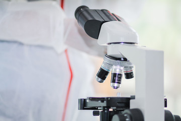 The medical team wore a coronavirus protective suit and rubber gloves to examine the coronavirus covid-19 and research for a vaccine to prevent coronavirus covid-19 to stop the epidemic.