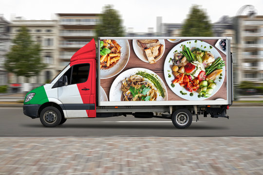 Italian delivery truck in motion on city street road.
