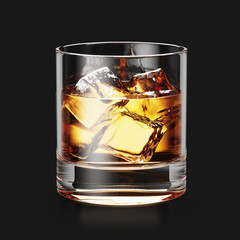 Glass of whiskey and ice on black background