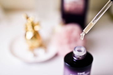 Cosmetic care serum in a fashionable bottle with a pipette.