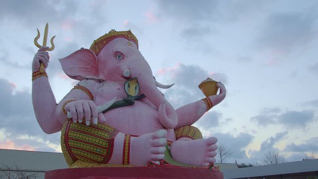 .Ganesha lord of success in sunrise..Ganesha Hindu God and the god of success in  Makha Bucha Buddhist memorial park at Nakornnayok province Thailand