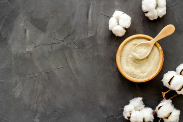 White cosmetic clay on black background top-down copy space