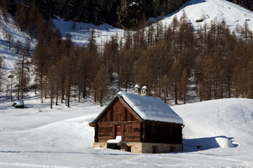 Devero Park ( Verbano-Cusio-Ossola ), Italy - January 15, 2017: Typical house in Alpe Devero Park, Ossola Valley, VCO, Piedmont, Italy