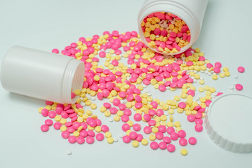 Many medicine pills on white background