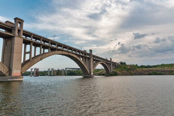 Fototapeta na wymiar Preobrazhensky bridge over the Dnieper river in Zaporizhia, Ukraine.