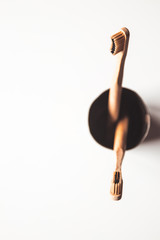 Wooden bamboo toothbrushes on white background isolated. The concept of zero waste, recycling