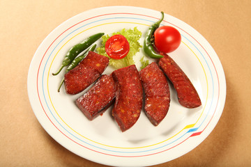 fried sausage and fresh vegetables