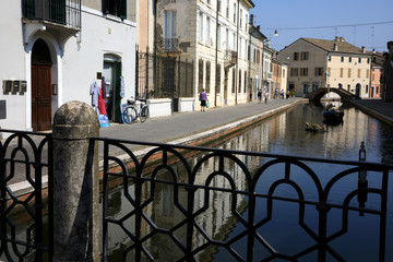 Comacchio (FE),  Italy - April 30, 2017: A tipycal canal in Comacchio village, Delta Regional Park, Emilia Romagna, Italy