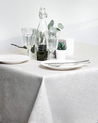 white plates on the festive table. serving in bright colors.