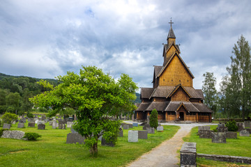 Fototapeta na wymiar old wooden church and cemetery in Norway