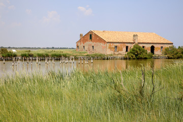 Po river (FE),  Italy - April 30, 2017: An old Fisherman's house on Po river, Delta Regional Park,...