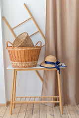 Fototapeta na wymiar Hat and basket on the wooden table