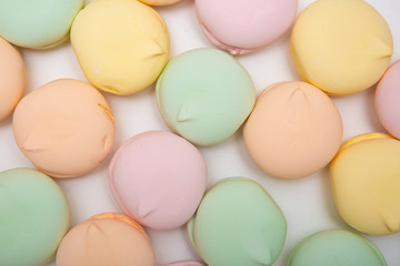 Colored sweet dessert zephyr marshmallows on white background. Air marshmallows. Confectionery.